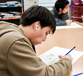 Boy in Brown sketching