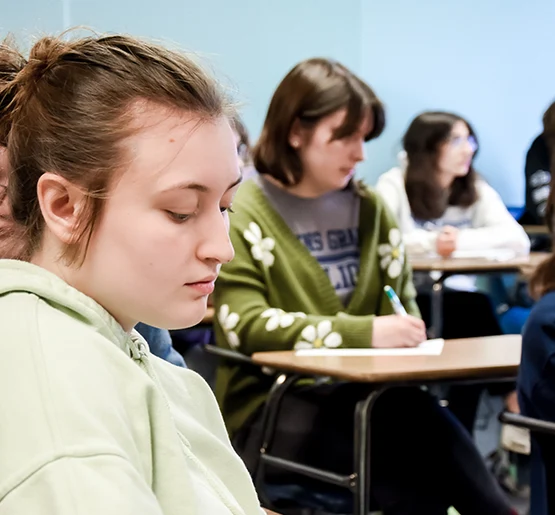 Girl in light green sweatshirt